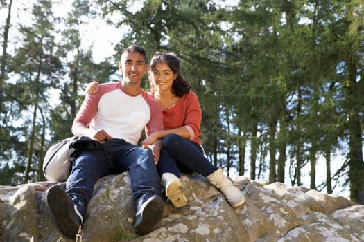 Young Couple Hiking Through Countryside