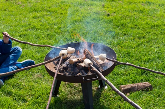 toasting bread on an open fire