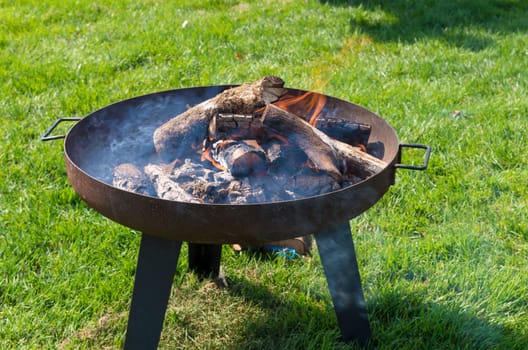 making a campfire in a metal bowl