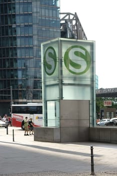 Berlin,Germany – June 21,2016: Road traffic,tourists and pedestrians at Potsdamer Platz opposite an S-Bahn station on June 21,2016 in Berlin.