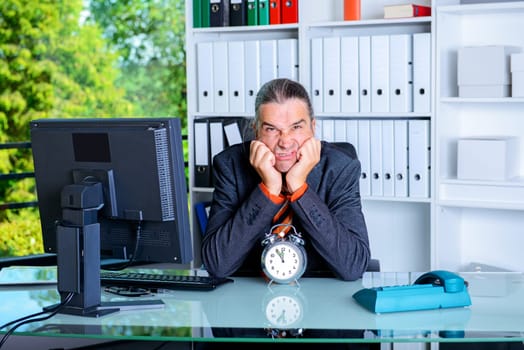 sad business man in office with clock