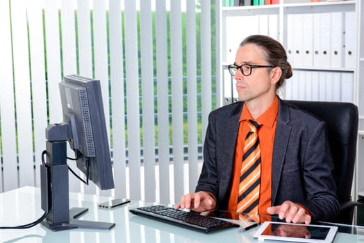 young business man at his desk working