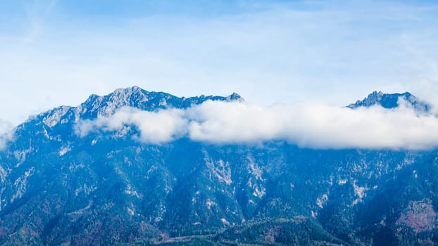 Clouds on mountain tops.  Mountain landscape with clouds. mountain landscape