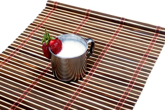 steel mug with milk drink on a rug, isolate, a subject drinks