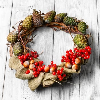 Noel wreath of fir branches decorated with Christmas star toys
