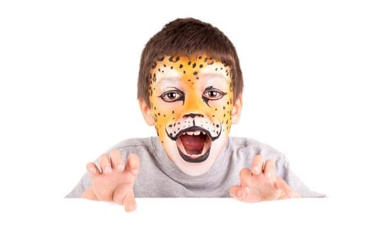 Boy with face-painted like a leopard isolated in white