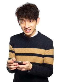 Young man using mobile phone SMS on white background