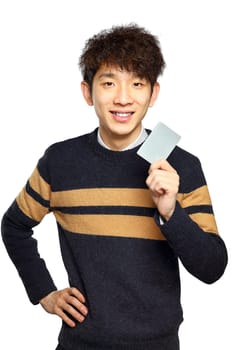 Asian young man holding card on white background