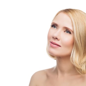 Beautiful middle aged woman with smooth skin and short blond hair. Beauty shot. Isolated over white background. Copy space.