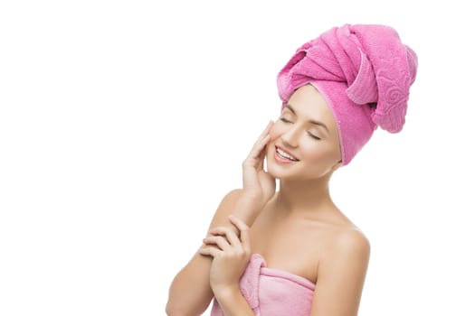Beautiful young woman in pink towel on head and body. Isolated over white background. Copy space.