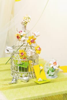 Set of two cages with flowers and decorated envelopes. Wedding gifts.