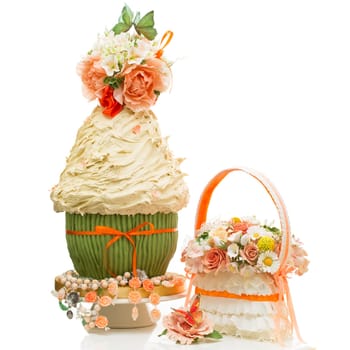 Stylish wedding cake decorated with flowers and bouquet isolated over white background