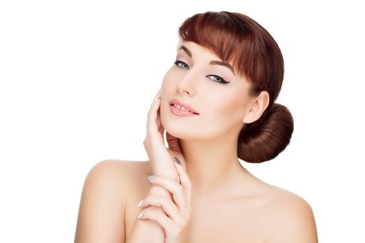 Beautiful young woman with red hair, makeup touching face. Beauty shot. Isolated over white background. Copy space.
