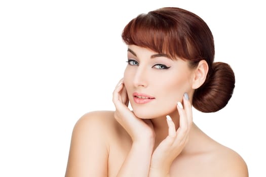 Beautiful young woman with red hair, makeup touching face. Beauty shot. Isolated over white background. Copy space.