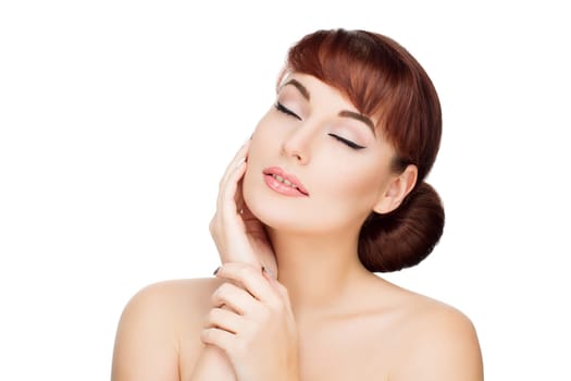 Beautiful young woman with red hair, makeup touching face. Beauty shot. Isolated over white background. Copy space.