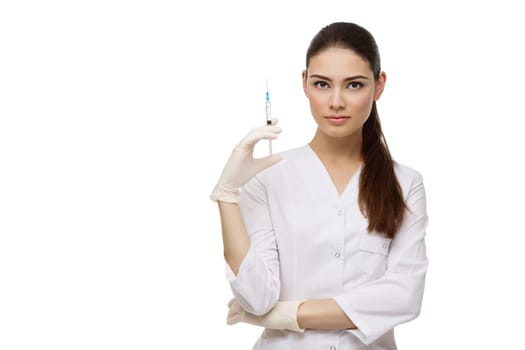 Beautiful young doctor woman in medical robe holding syringe. Isolated over white background. Copy space.