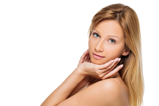 Close up portrait of beautiful young woman with blond straight long hair and natural make-up touching her face. Isolated over white background. Copy space.