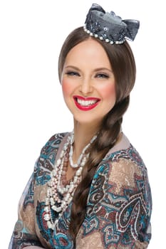 Beautiful happy young woman dressed in traditional Russian style. Isolated over white background.
