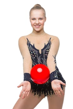 Gymnast girl in beautiful costume making jumping exercise with red ball. Isolated over white background. Copy space.
