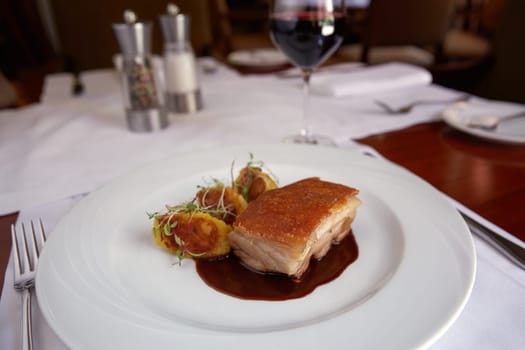 Traditional Peruvian Meal Called Chicharron de Panceta de Cerdo Served in a Restaurant.