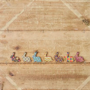 Colorful ashes on rustic wood as a background for Easter