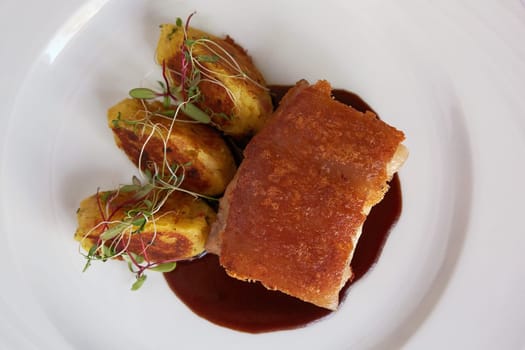Traditional Peruvian Meal Called Chicharron de Panceta de Cerdo Served in a Restaurant.