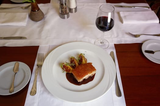 Traditional Peruvian Meal Called Chicharron de Panceta de Cerdo Served in a Restaurant.