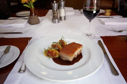 Traditional Peruvian Meal Called Chicharron de Panceta de Cerdo Served in a Restaurant.