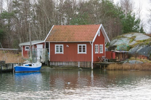 fishermans boathouse and boat with pier waiting to go out and fish