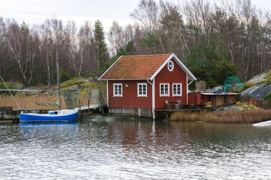 fishermans boathouse and boat with pier waiting to go out and fish