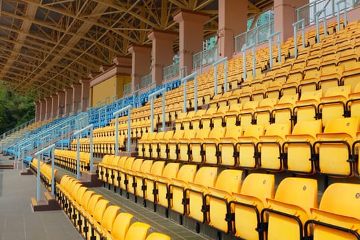 plastic seats in stadium at day