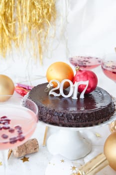 New Year's Eve party with chocolate cake and rose sparkling wine