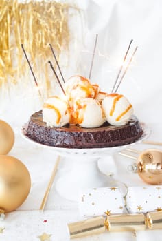 Chocolate cake with vanilla ice cream and sparklers