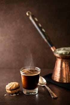 Cup of espresso coffee on dark background