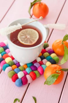 Cup of tea with lemon and fresh manderines