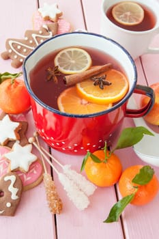 Homemade winter punch with oranges and waxes