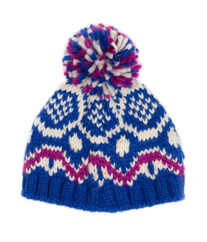 Blue warm knitted hat with a winter pattern. Isolate on white.