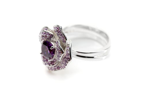 Silver ring with a purple stone isolated on white background