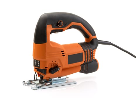 Professional electric jigsaw orange. Isolate on white.