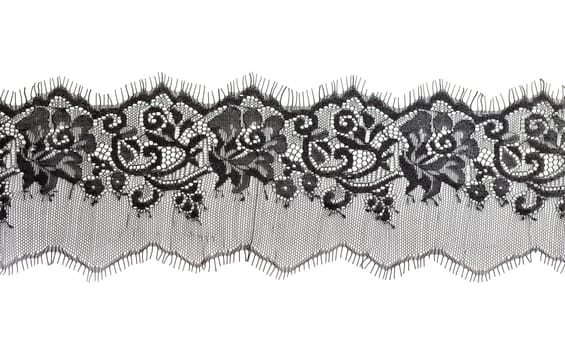 Black fine lace floral texture. Isolate on white.