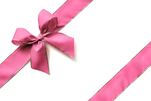 Pink ribbon and bow isolated