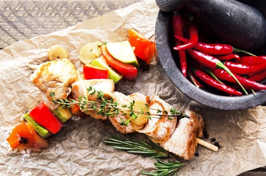 Two fried chicken skewers of grilled meat BBQ Kebab and vegetables