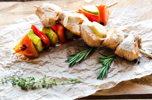 Two fried chicken skewers of grilled meat BBQ Kebab and vegetables