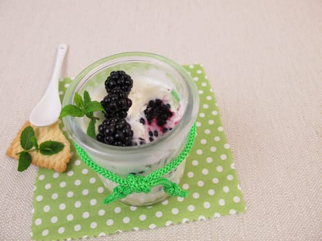 Baked yogurt with blackberries in a glass