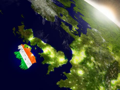 Ireland with embedded flag on planet surface during sunrise. 3D illustration with highly detailed realistic planet surface and visible city lights. Elements of this image furnished by NASA.