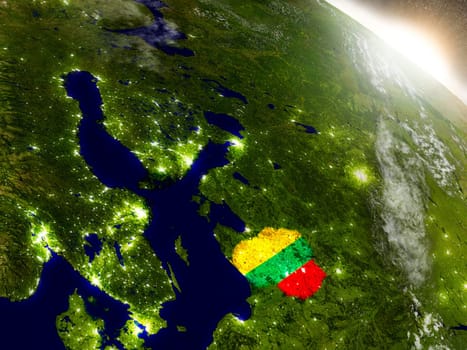 Lithuania with embedded flag on planet surface during sunrise. 3D illustration with highly detailed realistic planet surface and visible city lights. Elements of this image furnished by NASA.