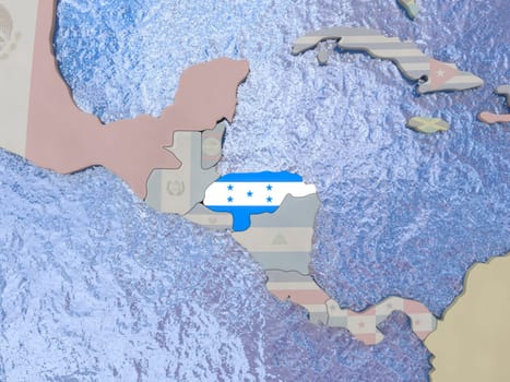 Map of Honduras with national flag on political globe with realistic water. 3D illustration