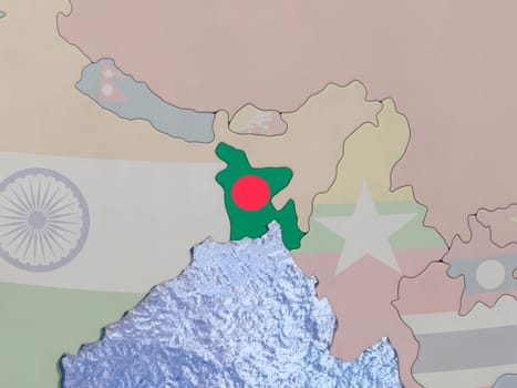 Map of Bangladesh with national flag on political globe with realistic water. 3D illustration