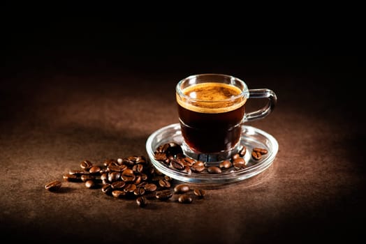 Cup of espresso coffee on dark background