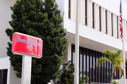 Fort Lauderdale, FL, USA - April 24, 2016: Red, blue and white Bank of America sign in front of the branches location. Bank of America first floor location with sign.